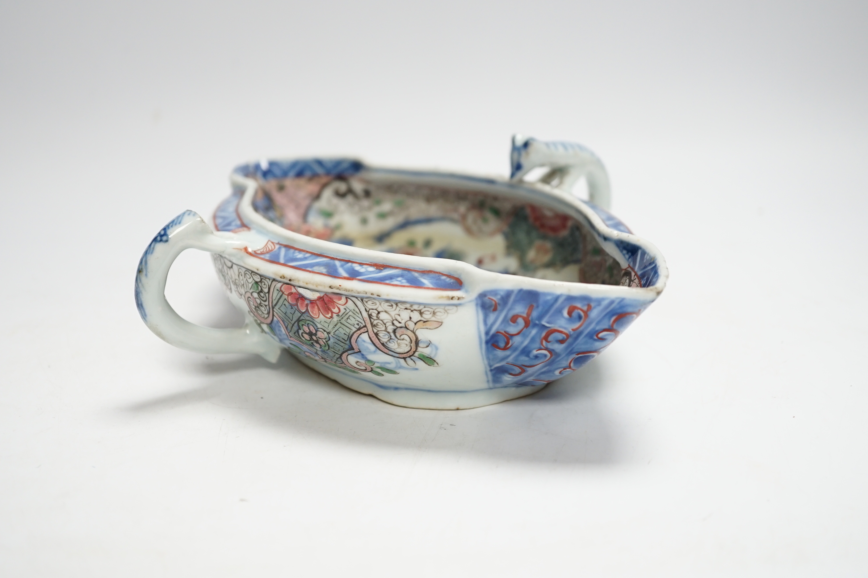 A Chinese clobbered blue and white double lipped sauceboat, Qianlong period, 23cm high